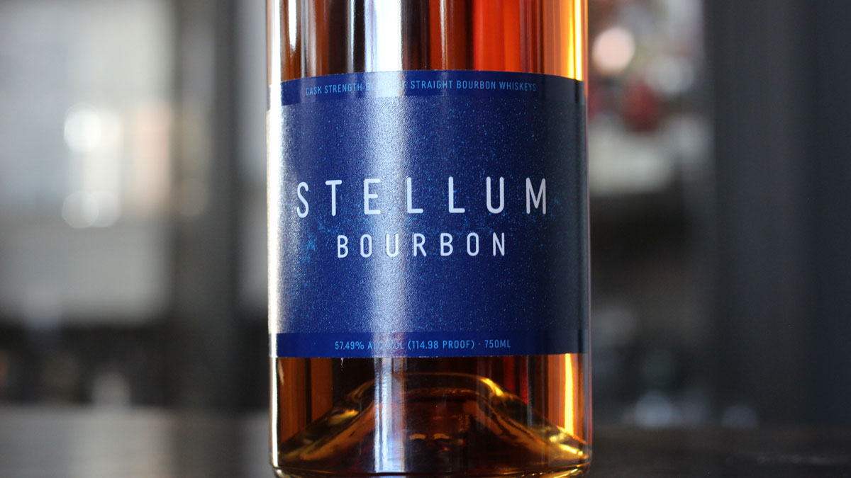 A close up of the label on a bottle of Stellum Bourbon.