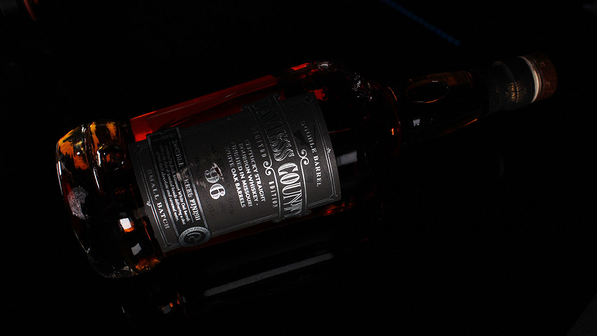 A bottle of Daviess County Double Barrel Finish lying on a table.